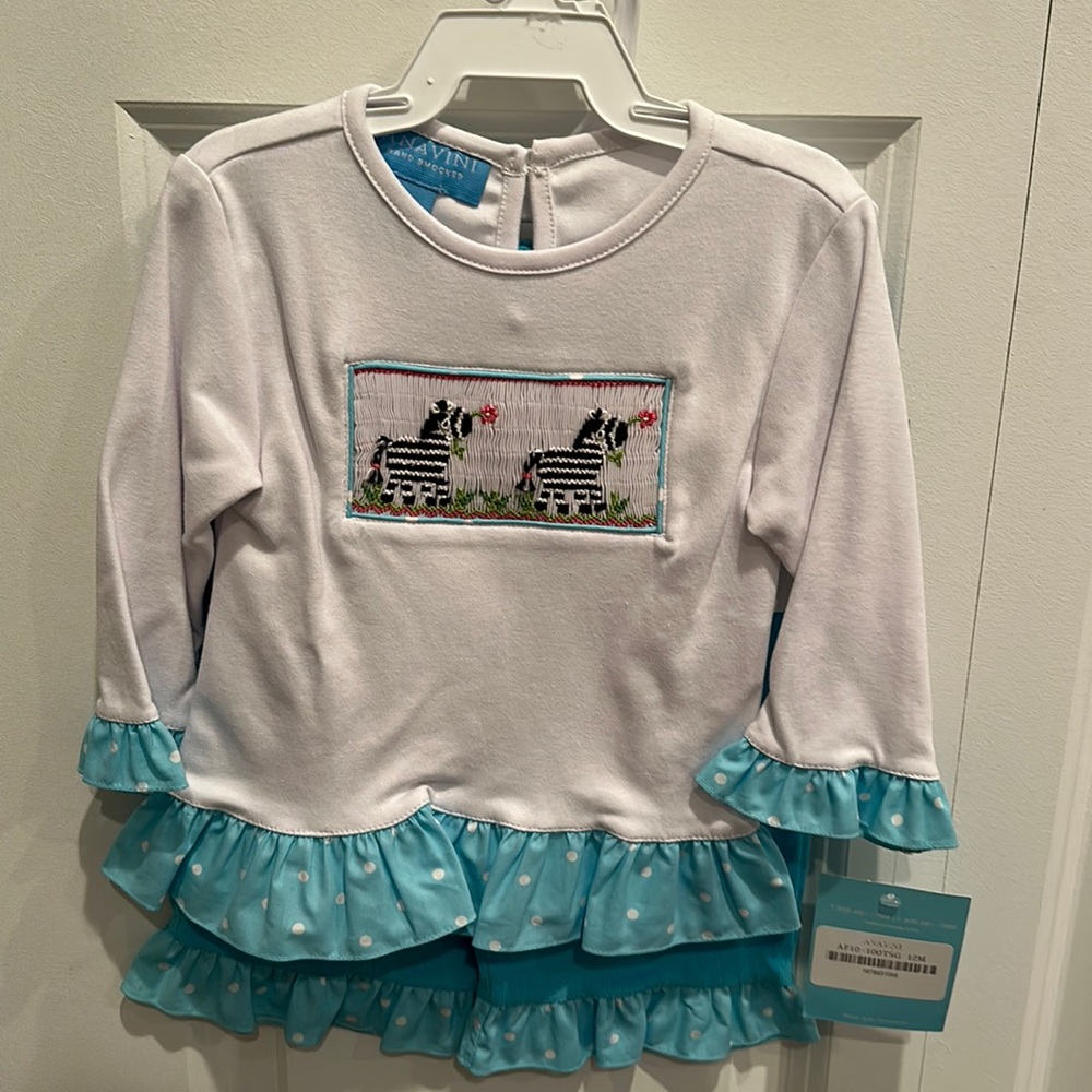 Super cute zebra outfit with polkadots and corduroy pants. Super cute.